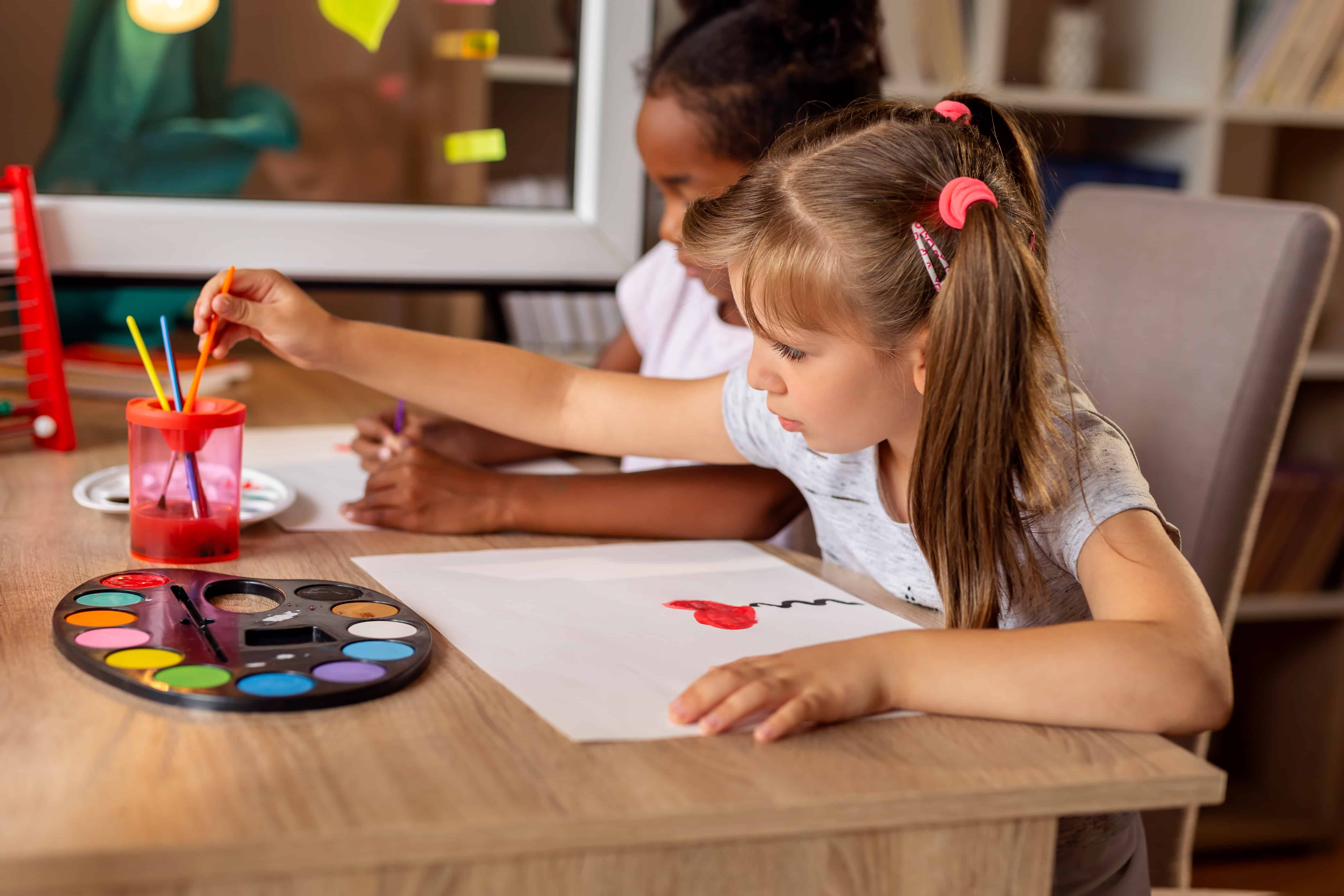 Children doing art class at home